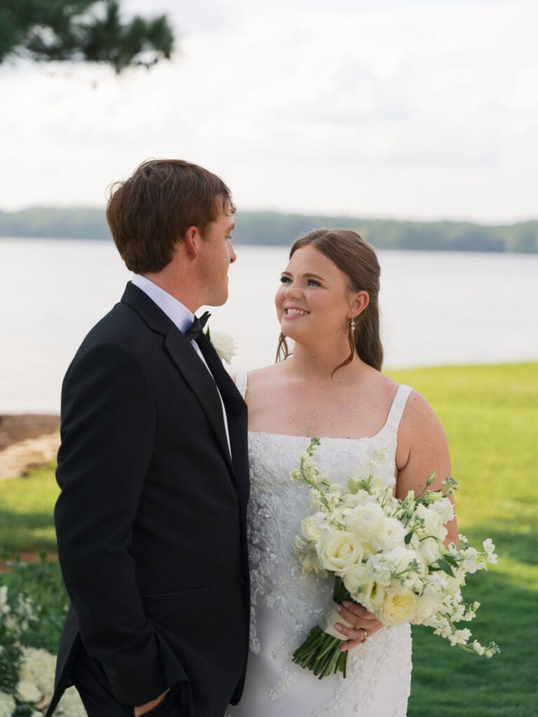 a bride adoringly looking up at her new husband