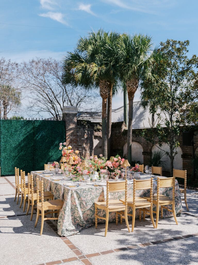 Wedding table decorated with beautiful spring florals at the Gadsden House in Charleston.